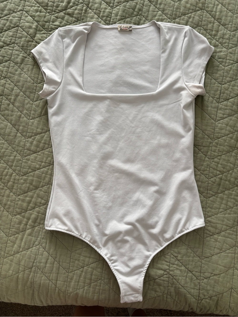 White Bodysuit with Decorative Label